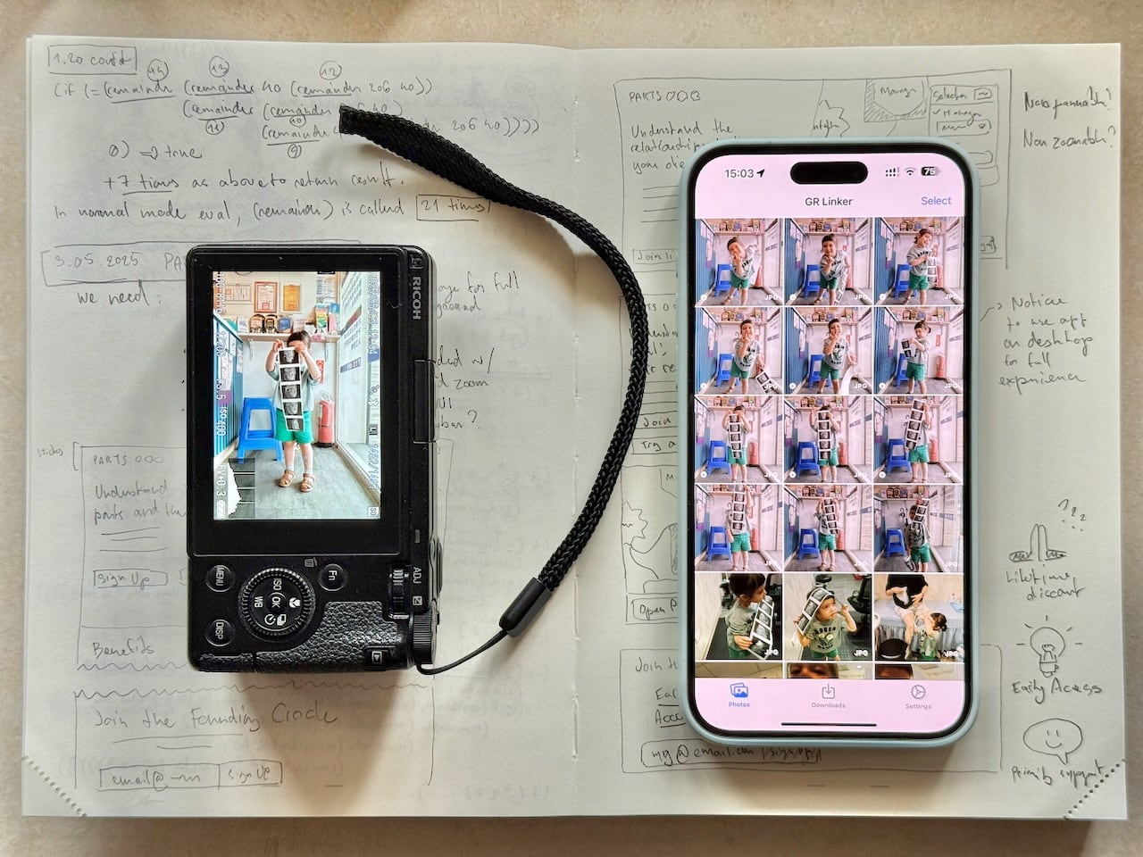A Ricoh GR III camera next to an iPhone running the GR Linker app