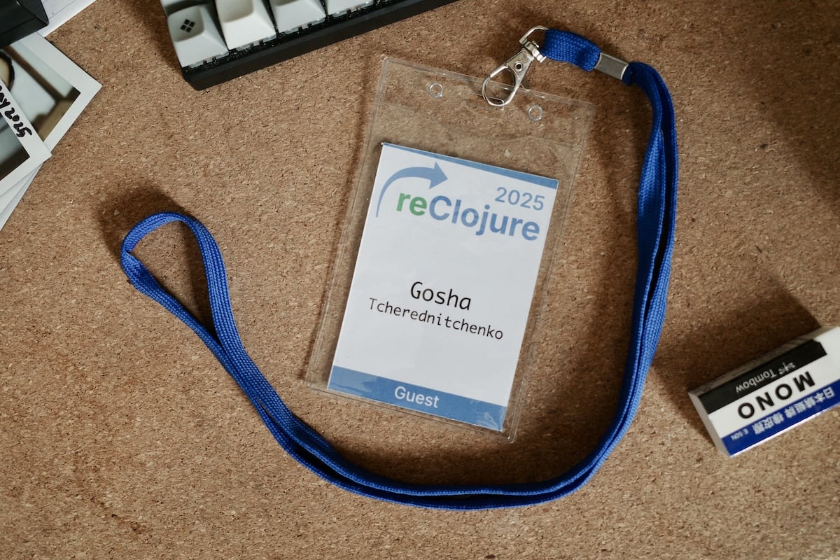 A conference attendee badge on a desk